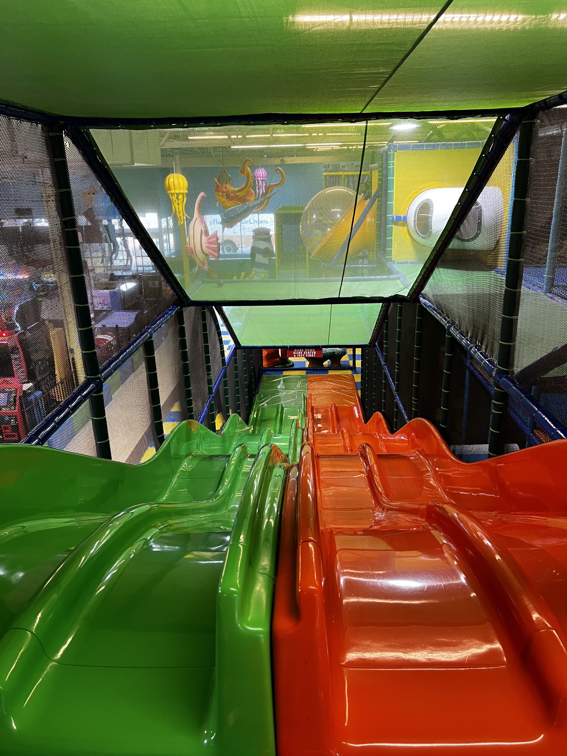 Green and orange slides at Kids Wonderland McAllen